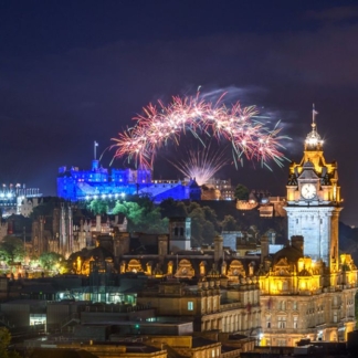 Edinburgh Castle illuminated by fireworks during the Edinburgh Fringe and International Festival.